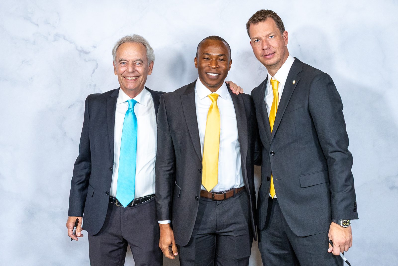 Hugh Hilton (left) and JT Foxx (right) with Aniemi Umana