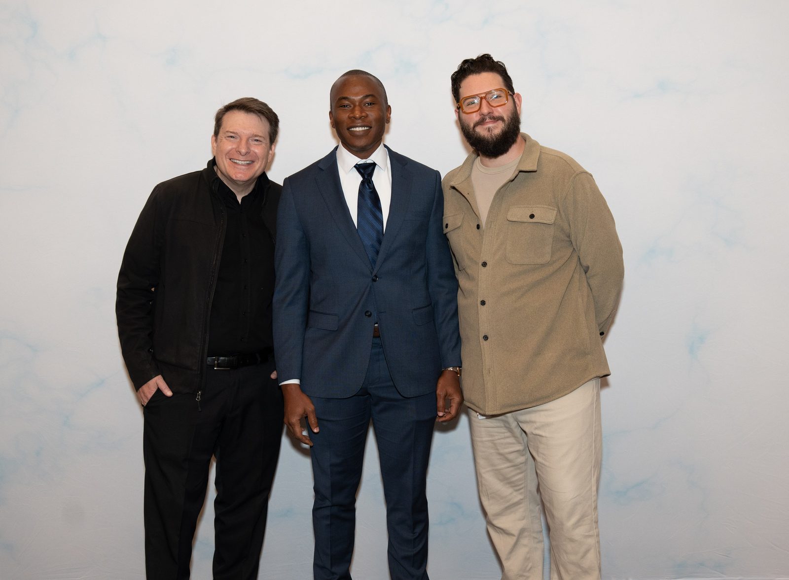 Phillip Wilburn, Aniemi Umana, and Ewan Gotfryd posing together at an entertainment industry event